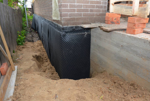Happy homeowners after waterproofing job in Maple Plain